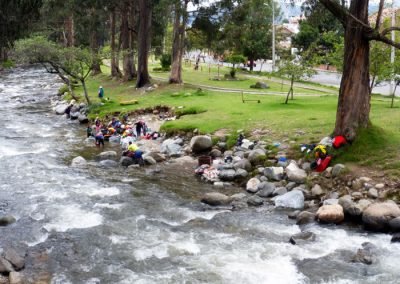 Locals doing their laundry in the Rio Tomebamba; Cuenca Ecuador