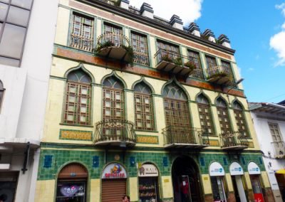 Pretty yellow and green building; Cuenca Ecuador